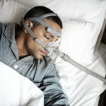 Sick man wearing an oxygen mask